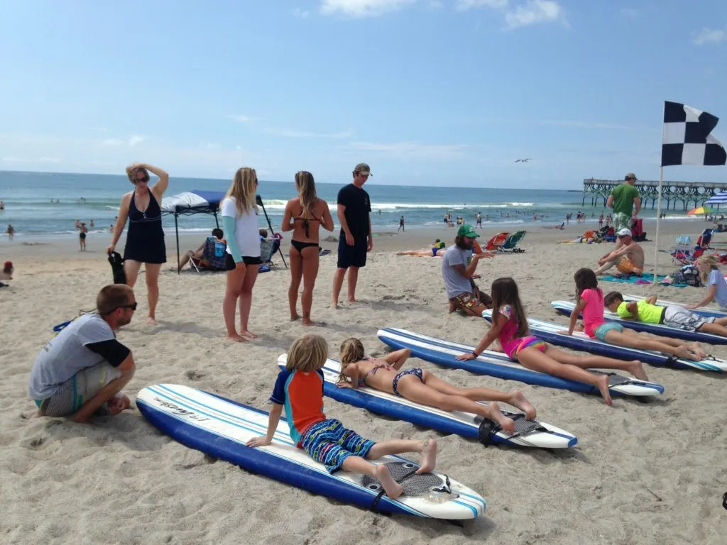 Kids learning to surf